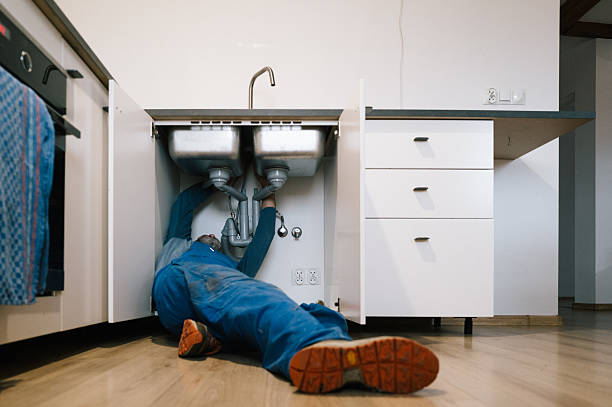 Professional Emergency Plumber technician working in Farley, MO